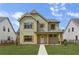 Charming two-story home featuring a well-manicured lawn, complemented by board and batten siding and detailed window shutters at 38 Puckett Se Rd, Emerson, GA 30137