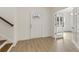 Bright foyer with white walls, wood floors, front door, and open french doors to an office space at 38 Puckett Se Rd, Emerson, GA 30137
