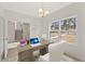 Well-lit home office space, complete with a desk, chair, and large window providing scenic views at 38 Puckett Se Rd, Emerson, GA 30137
