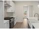 Modern kitchen with quartz countertops, stainless steel appliances, and a stylish backsplash at 38 Puckett Se Rd, Emerson, GA 30137
