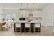 Modern kitchen with a large dark island, white cabinets, stainless steel appliances, and pendant lighting at 38 Puckett Se Rd, Emerson, GA 30137