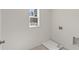 Bright laundry room features a window and hookups at 38 Puckett Se Rd, Emerson, GA 30137