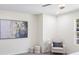 Well-lit bedroom showcasing neutral walls, accent chair, and modern decor at 1270 Graymont Sw Dr, Atlanta, GA 30310