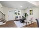 Bright living room with hardwood floors, neutral color scheme, and a cozy seating area at 1270 Graymont Sw Dr, Atlanta, GA 30310