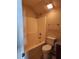 Bathroom with a standard white tub/shower and toilet at 424 Village Way, Loganville, GA 30052