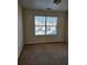 Bedroom featuring wall-to-wall carpeting and a window with blinds at 424 Village Way, Loganville, GA 30052