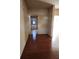 Hallway with hardwood floors that provides access to the rest of the home at 424 Village Way, Loganville, GA 30052