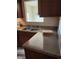 View of the kitchen featuring a speckled countertop and stainless steel sink at 424 Village Way, Loganville, GA 30052