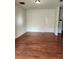Spacious living room with hardwood flooring and neutral-colored walls at 424 Village Way, Loganville, GA 30052