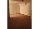 View of the living room featuring beige walls and carpeted floors at 424 Village Way, Loganville, GA 30052