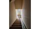 View of a stairway with lift assistance on a carpeted staircase at 424 Village Way, Loganville, GA 30052