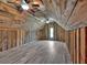 Finished attic space with wood paneled walls, hardwood flooring and ceiling fans at 36 Latimer Nw Ln, Cartersville, GA 30121
