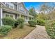 Side view of a two-story home with a porch, beautiful landscaping, and manicured lawn at 36 Latimer Nw Ln, Cartersville, GA 30121