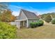 Garage exterior with gray siding, an awning and white picket fencing at 36 Latimer Nw Ln, Cartersville, GA 30121