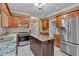 An eat-in kitchen has a center island, granite countertops and stainless steel appliances at 36 Latimer Nw Ln, Cartersville, GA 30121