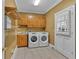 The laundry room features a washer, dryer and folding shelves at 36 Latimer Nw Ln, Cartersville, GA 30121