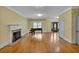 Spacious living room with hardwood floors, fireplace, and piano, exuding classic charm at 36 Latimer Nw Ln, Cartersville, GA 30121