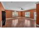 A large living room has wood floors, crown molding and natural light at 36 Latimer Nw Ln, Cartersville, GA 30121