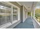 Inviting front porch features white railings and wood plank flooring at 36 Latimer Nw Ln, Cartersville, GA 30121