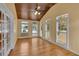 Bright sunroom featuring wood-paneled ceiling, fan, and plantation shutters at 36 Latimer Nw Ln, Cartersville, GA 30121
