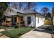 White bungalow with a spacious front yard and driveway at 1110 Mcdaniel Sw St, Atlanta, GA 30310