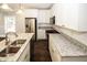 Modern kitchen with stainless steel appliances and granite countertops at 1110 Mcdaniel Sw St, Atlanta, GA 30310