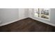 Hardwood floors and neutral walls in this bright living room at 1110 Mcdaniel Sw St, Atlanta, GA 30310