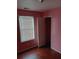Bedroom featuring a window and laminate flooring at 6579 Alford Way, Lithonia, GA 30058