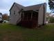 Back of house with a yard, stairs, a screened porch, and siding at 6579 Alford Way, Lithonia, GA 30058