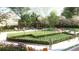 Manicured backyard featuring bocce ball court, outdoor dining and seating areas with mature trees at 2660 Peachtree Nw Rd # 18G, Atlanta, GA 30305