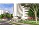 View of building's main entrance with portico, landscaping and well manicured road appeal at 2660 Peachtree Nw Rd # 18G, Atlanta, GA 30305