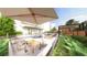 Outdoor seating next to the stunning pool with shade trees and other mature landscaping at 2660 Peachtree Nw Rd # 18G, Atlanta, GA 30305