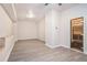 Finished basement with wood look floors, a built in bar, and a sauna at 5810 Collier Bridge Ln, Hoschton, GA 30548