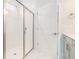 Bathroom featuring glass shower doors, a white subway tile shower, and marble floors at 5810 Collier Bridge Ln, Hoschton, GA 30548