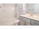 Clean bathroom with a shower and tub combination, a white vanity and a toilet at 5810 Collier Bridge Ln, Hoschton, GA 30548