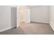 Cozy bedroom with carpet and doors leading to the bathroom and closet at 5810 Collier Bridge Ln, Hoschton, GA 30548