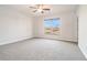 Bedroom with carpet, a window that overlooks the backyard and good natural light at 5810 Collier Bridge Ln, Hoschton, GA 30548