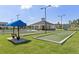 Bocce ball court with shaded seating, great for entertaining and relaxing at 5810 Collier Bridge Ln, Hoschton, GA 30548