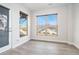 Bonus room with two windows and a glass panel door leading to the backyard at 5810 Collier Bridge Ln, Hoschton, GA 30548