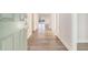 Inviting entryway with light wood flooring leading into a bright and open living space at 5810 Collier Bridge Ln, Hoschton, GA 30548