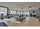Community gym featuring cardio and weight machines, with large windows for natural light and multiple ceiling fans at 5810 Collier Bridge Ln, Hoschton, GA 30548