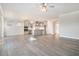 Spacious open-concept living room and kitchen area with stylish grey cabinets and stainless appliances at 5810 Collier Bridge Ln, Hoschton, GA 30548