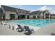 Resort style pool with lounge chairs and chairs for relaxing in the sun at 5810 Collier Bridge Ln, Hoschton, GA 30548