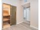 Sauna room with glass door and benches, tile floors, and neutral colored walls at 5810 Collier Bridge Ln, Hoschton, GA 30548