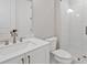 Modern bathroom with white tile shower and vanity at 509 Pearl St, Cumming, GA 30040