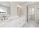 Double vanity bathroom with modern fixtures and mirror at 509 Pearl St, Cumming, GA 30040