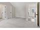 Carpeted bedroom with two doors and a view of the upper floor at 509 Pearl St, Cumming, GA 30040