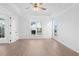 Bright bedroom with hardwood floors, recessed lighting, large windows, and tray ceiling at 509 Pearl St, Cumming, GA 30040