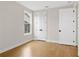 Simple bedroom with hardwood floors and white doors at 509 Pearl St, Cumming, GA 30040