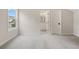 Bright bedroom with carpeting, an ensuite bathroom, and a window with a view at 509 Pearl St, Cumming, GA 30040